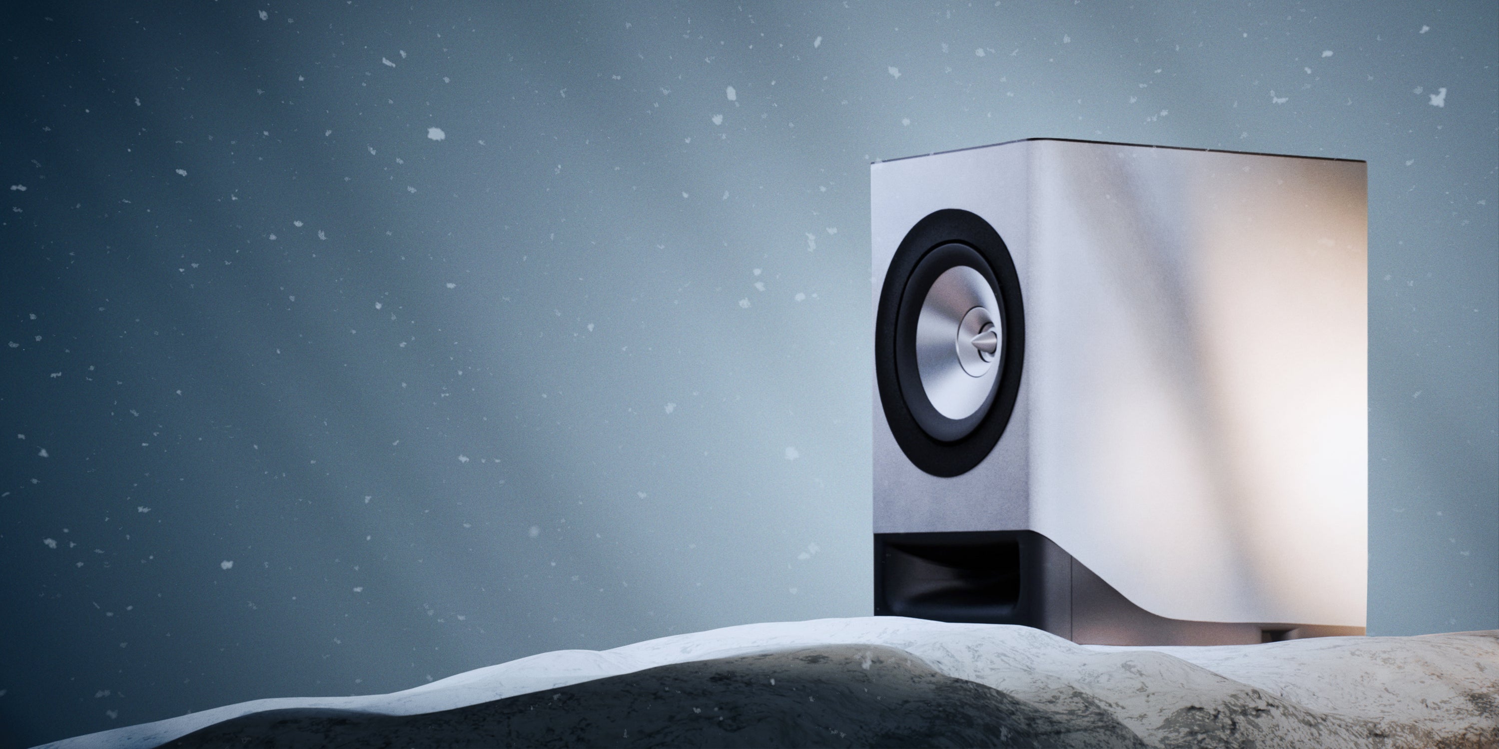 Modern speaker on a snowy landscape with a dark blue sky