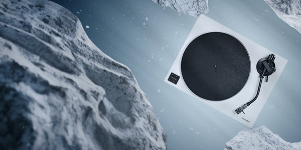 Turntable on a snowy landscape with a mountainous background